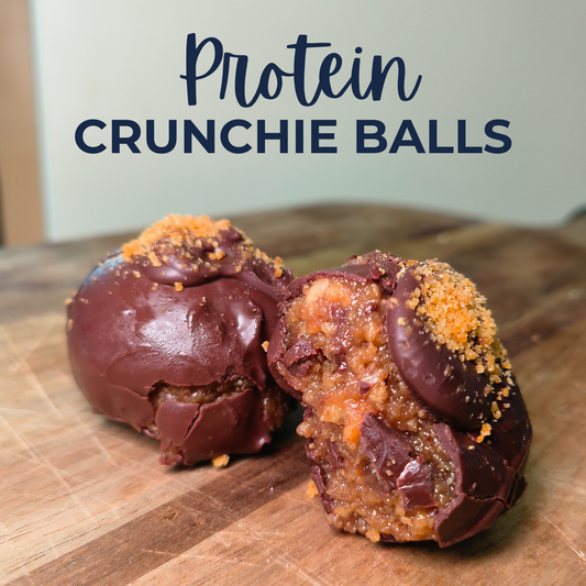 Protein crunchie balls on a wooden surface with text overlay
